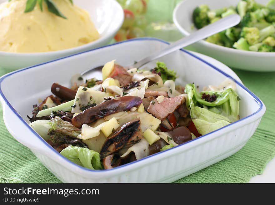 Healthy and light mushroom, fresh lettuce, brinjal and sliced grilled beef salad