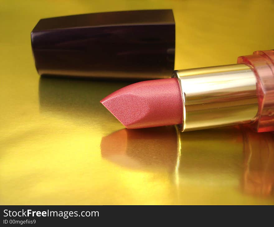 Pink lipstick on golden