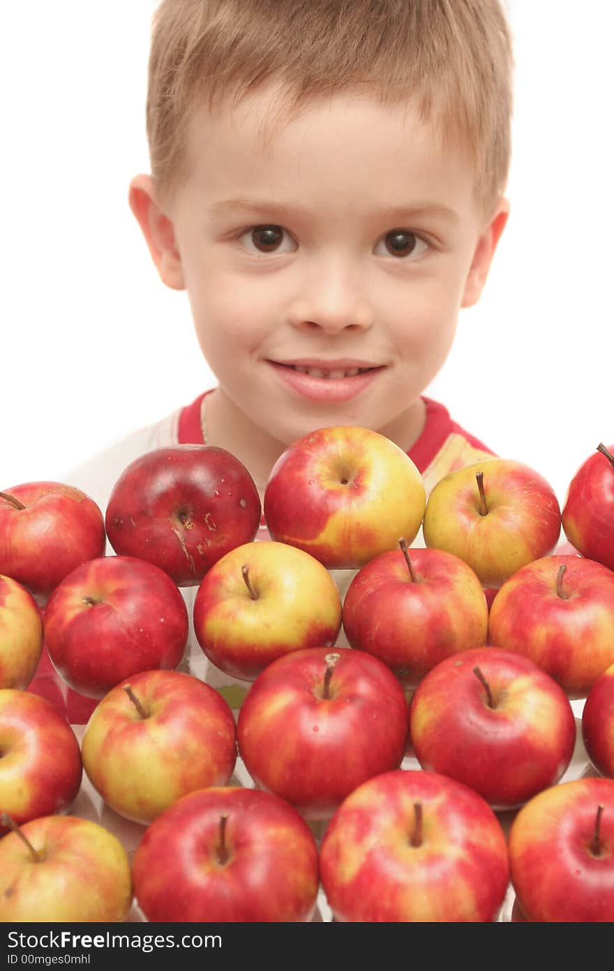 The person of the boy and many red apples