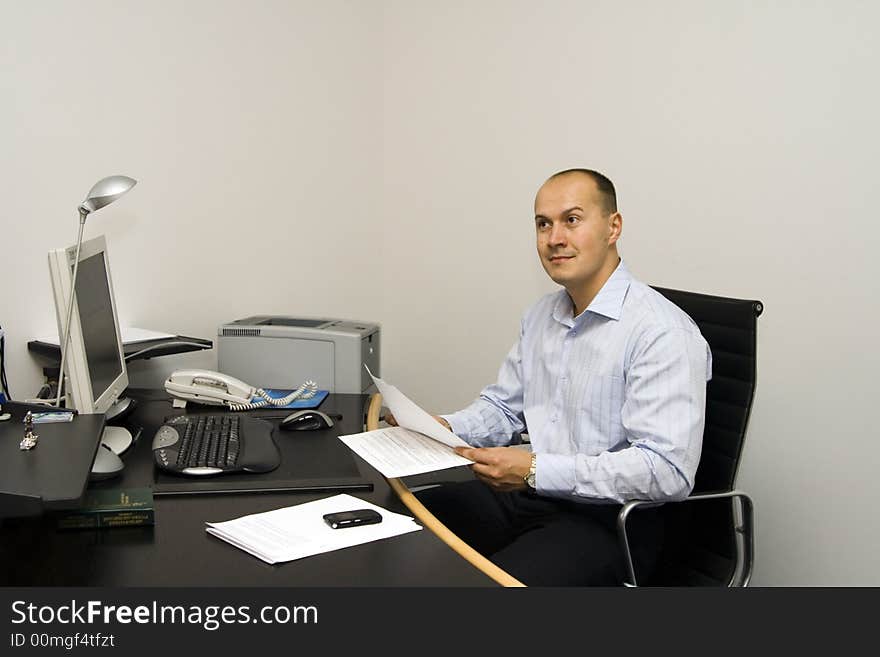 Businessman working with papers at office