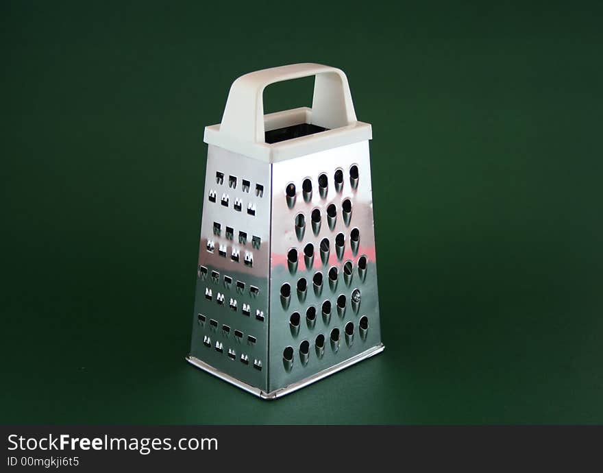 Grater on green background in light tent. Grater on green background in light tent