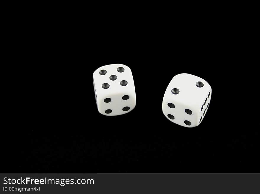 Seven and boxcars dice isolated on black background