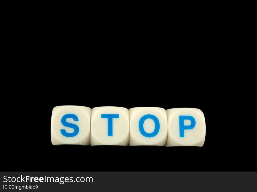 The word stop spelled in blocks isolated