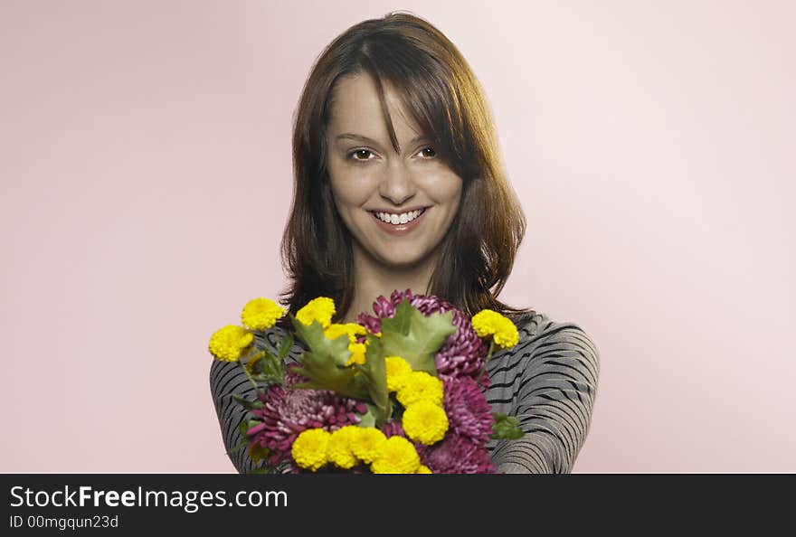 Woman hands out a bouquet of flowers. Woman hands out a bouquet of flowers