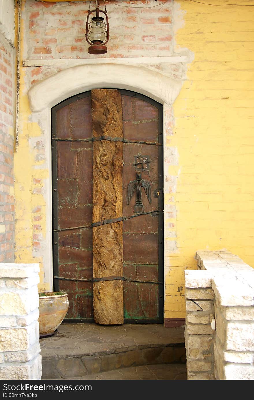 Ancient stone doorway and old door. Ancient stone doorway and old door