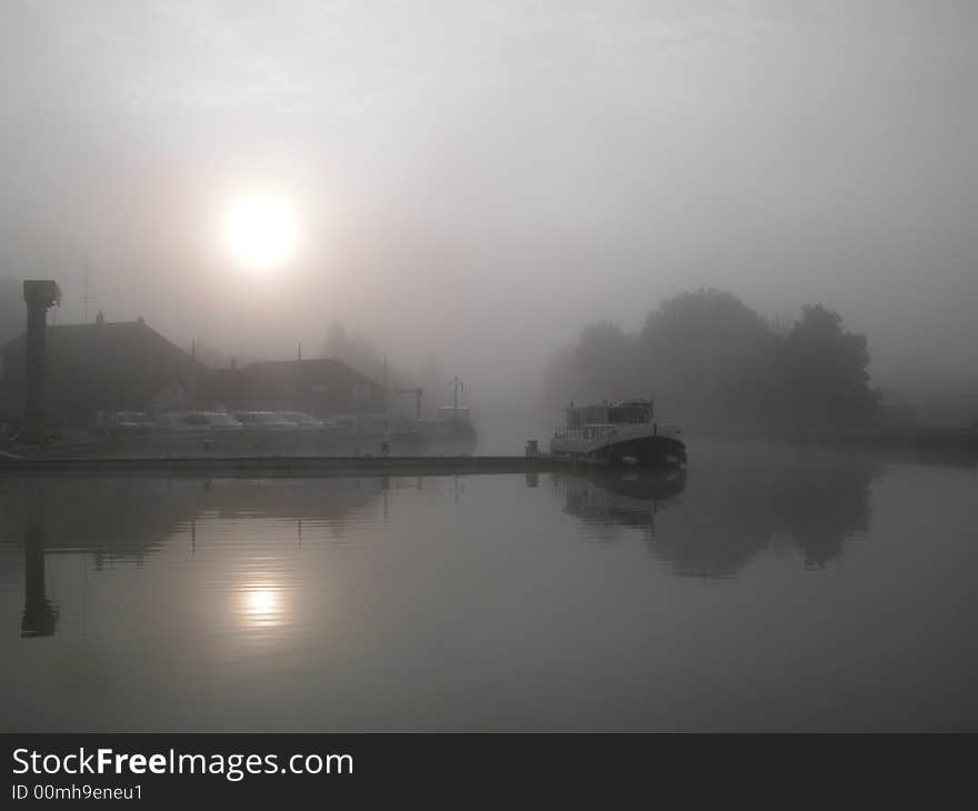 French channel boat in a foggy weather morning