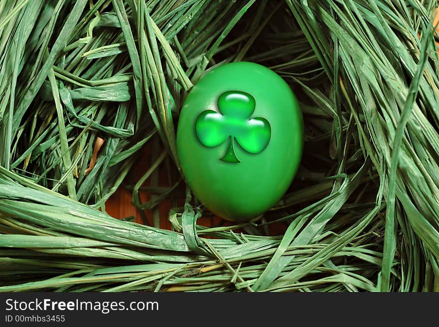 Nest with a green egg