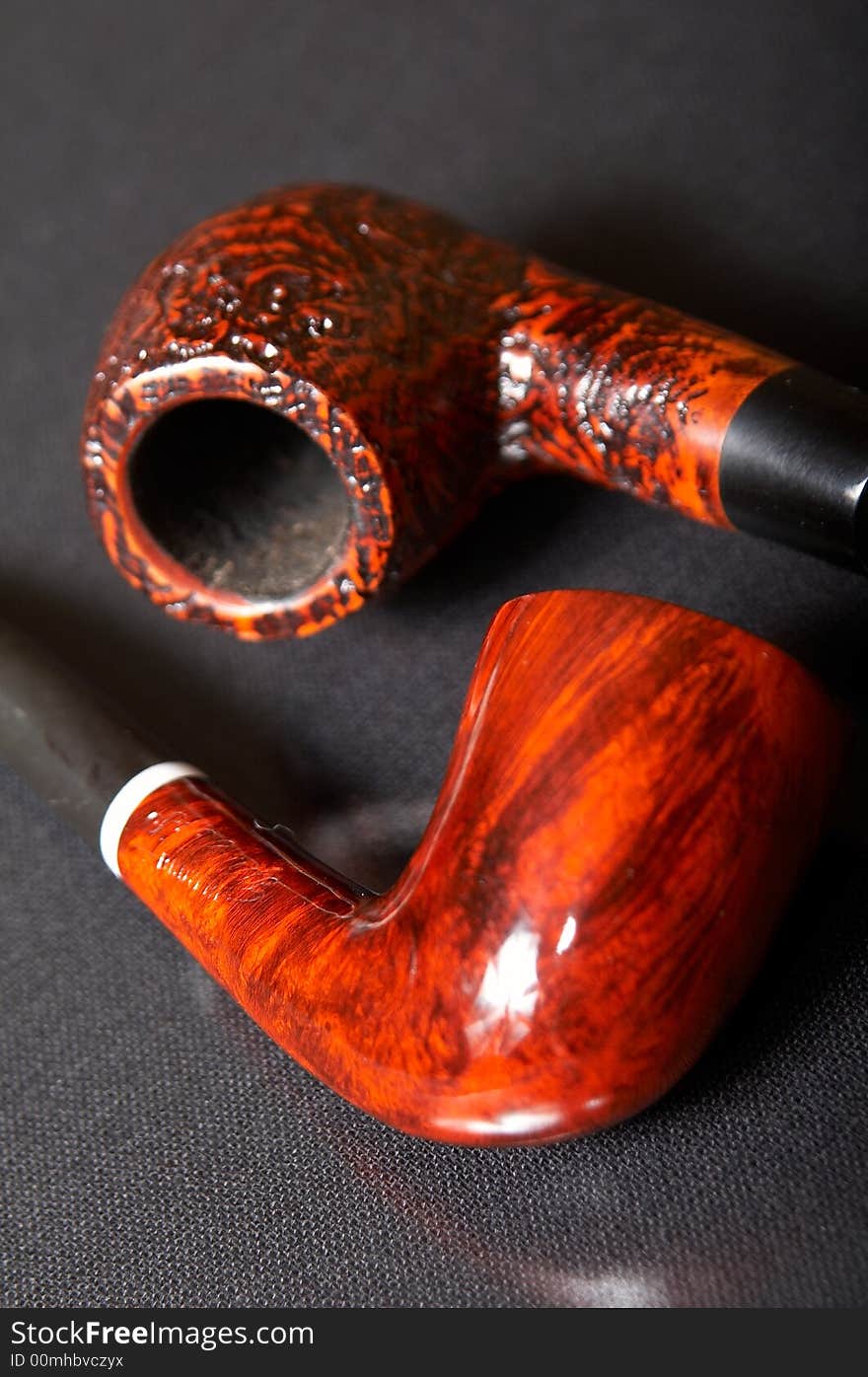 Red textured smoking pipe at black background. Red textured smoking pipe at black background