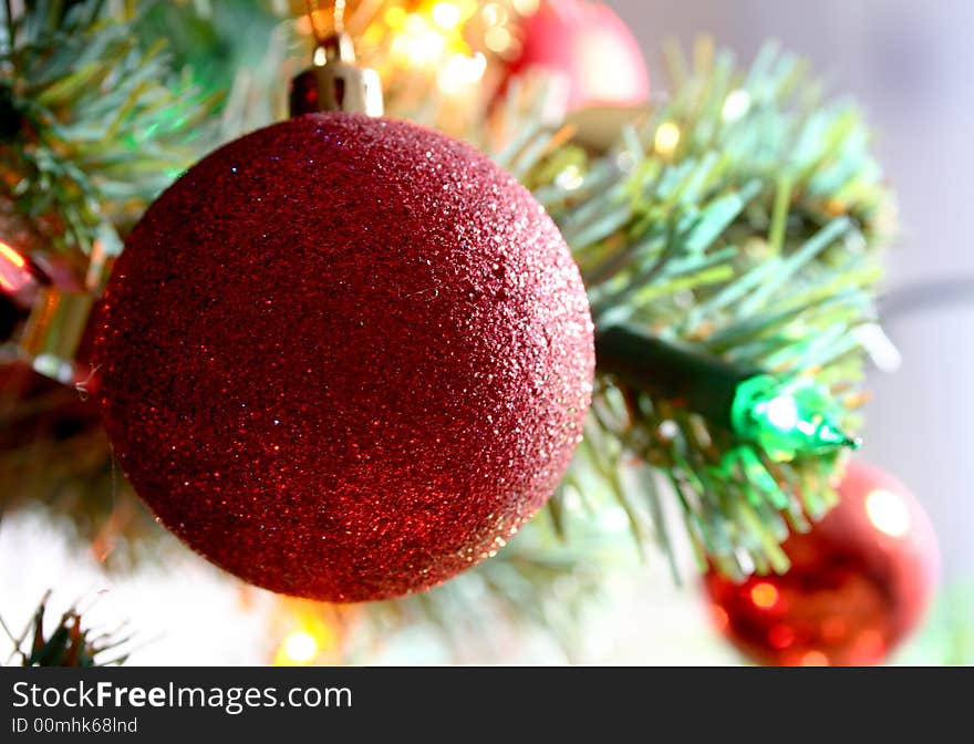 Red glass ball on Christmas tree. Red glass ball on Christmas tree