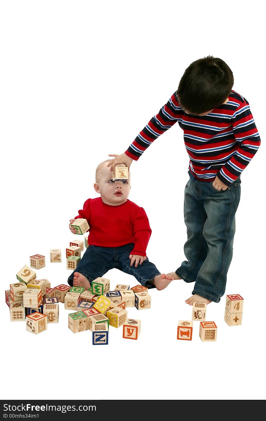 Brother and sister playing with blocks over white.  Clipping path included. Brother and sister playing with blocks over white.  Clipping path included.