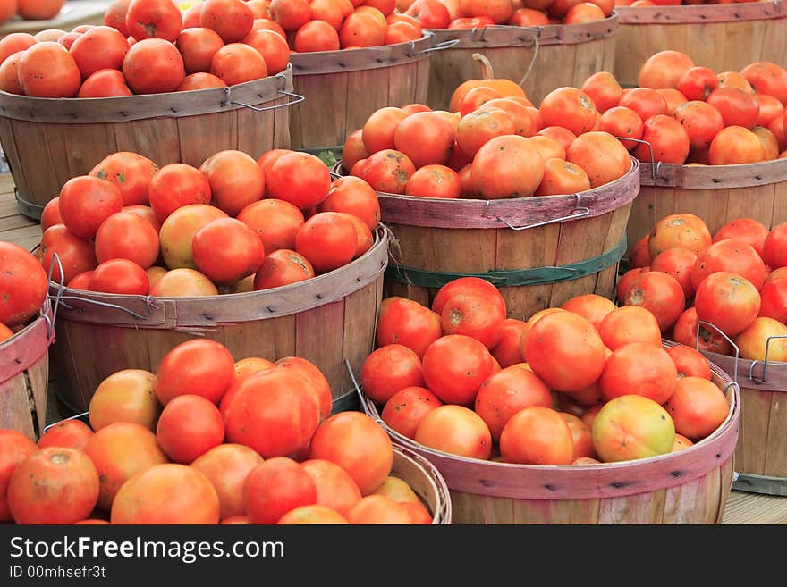 Tomatoes in baskets at the farm stand