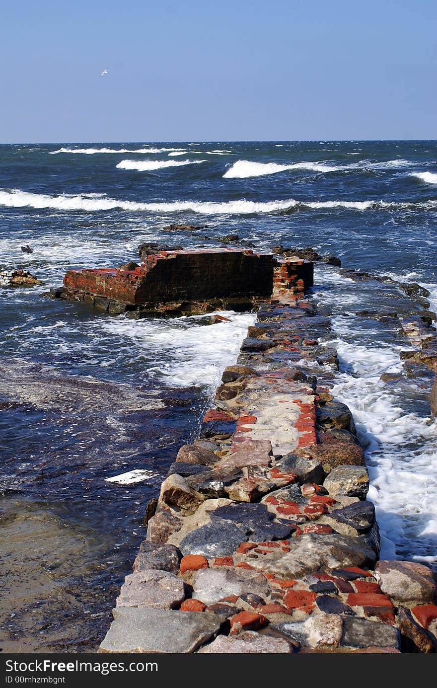 Brick wall and sea