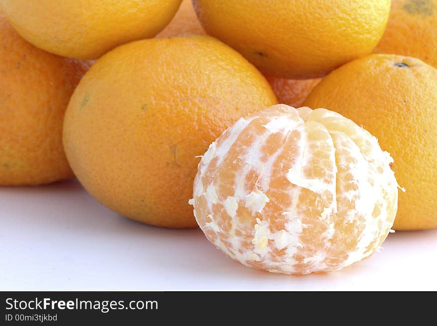 Tangerine peeled in background white