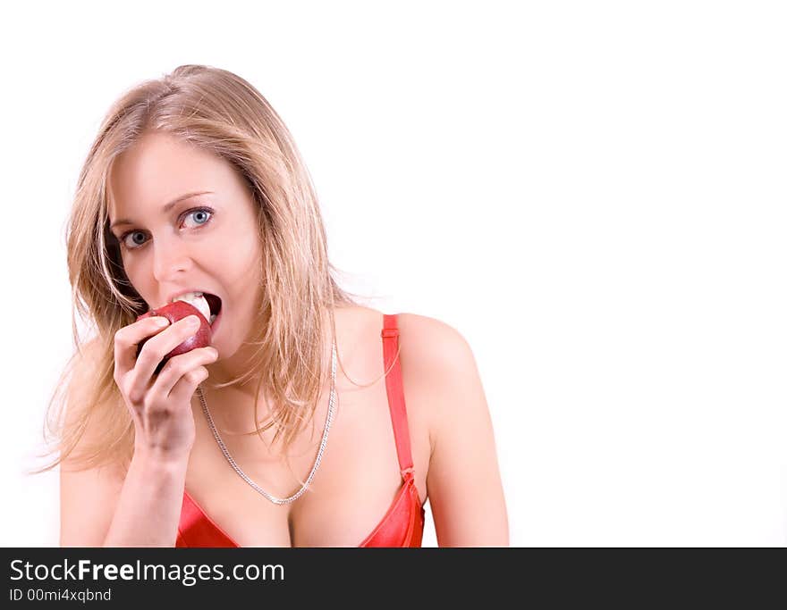 A girl eating an apple isolated on white. A girl eating an apple isolated on white