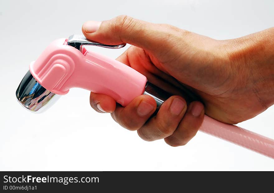 Hand using a hose pipe image on the white background. Hand using a hose pipe image on the white background