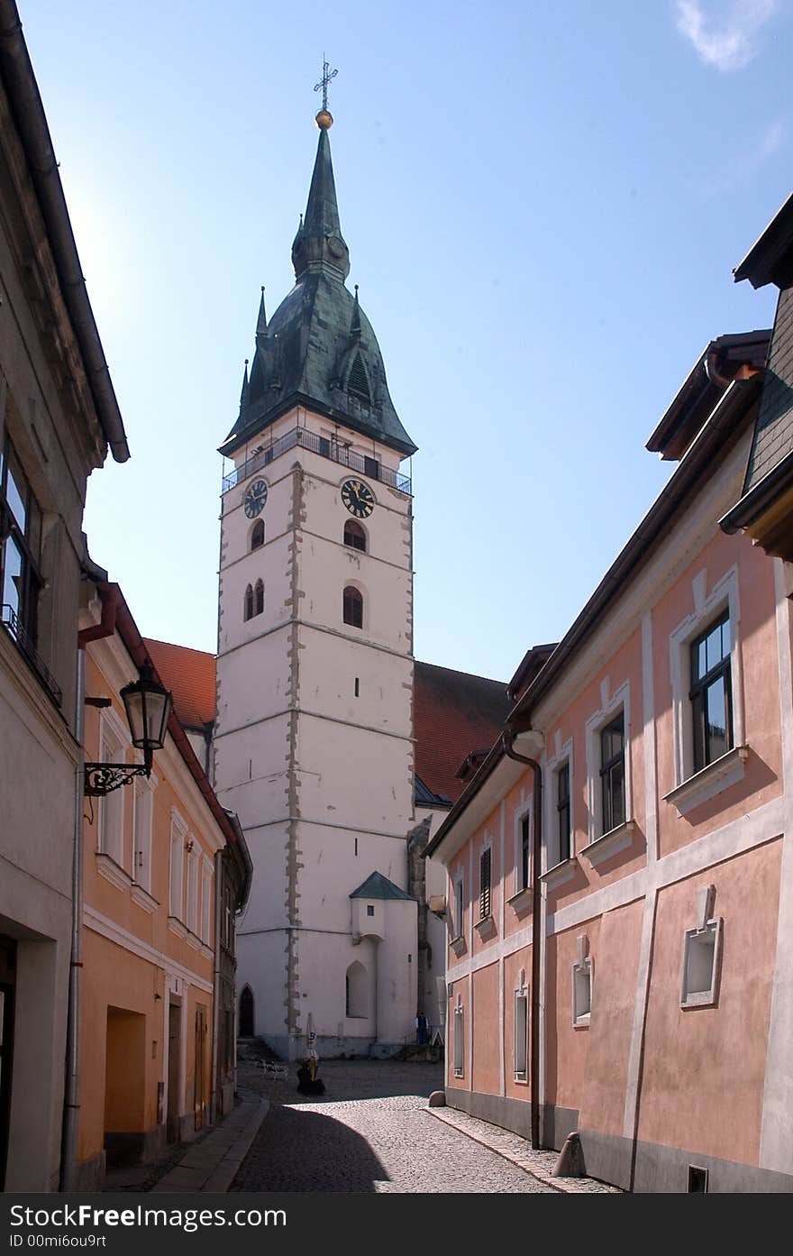 A tower with a clock in an old town