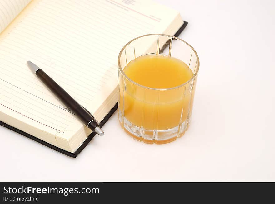 Orange juice and a diary