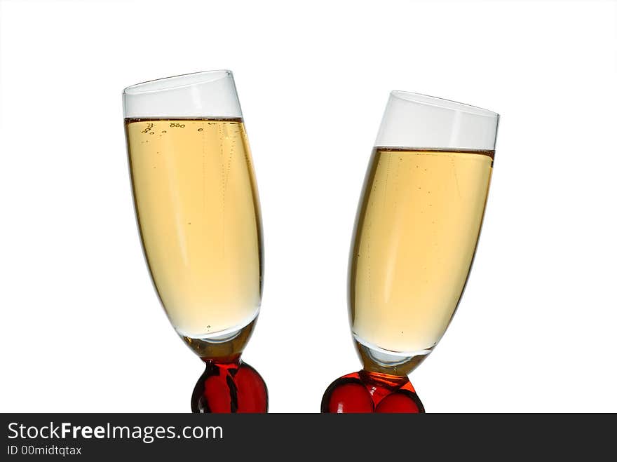 Pair of original wine glasses with champagne isolated on white background. Pair of original wine glasses with champagne isolated on white background