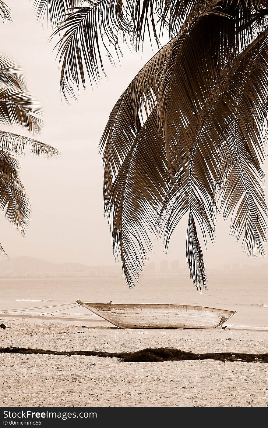 Boat and coconut tree in Sanya beach, Hainan island,China. Boat and coconut tree in Sanya beach, Hainan island,China