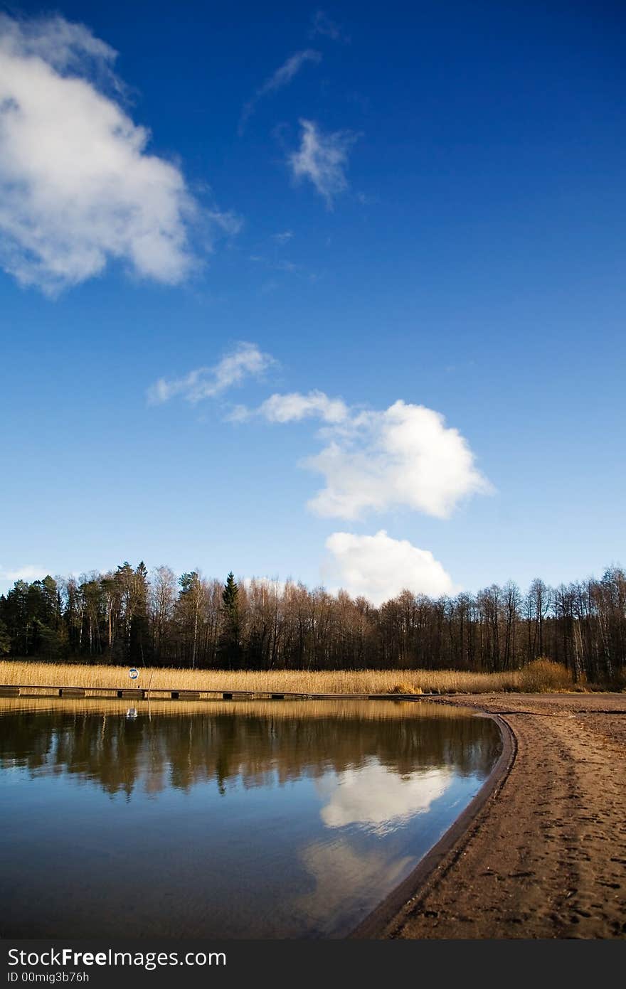 Autumn landscape with water reflection