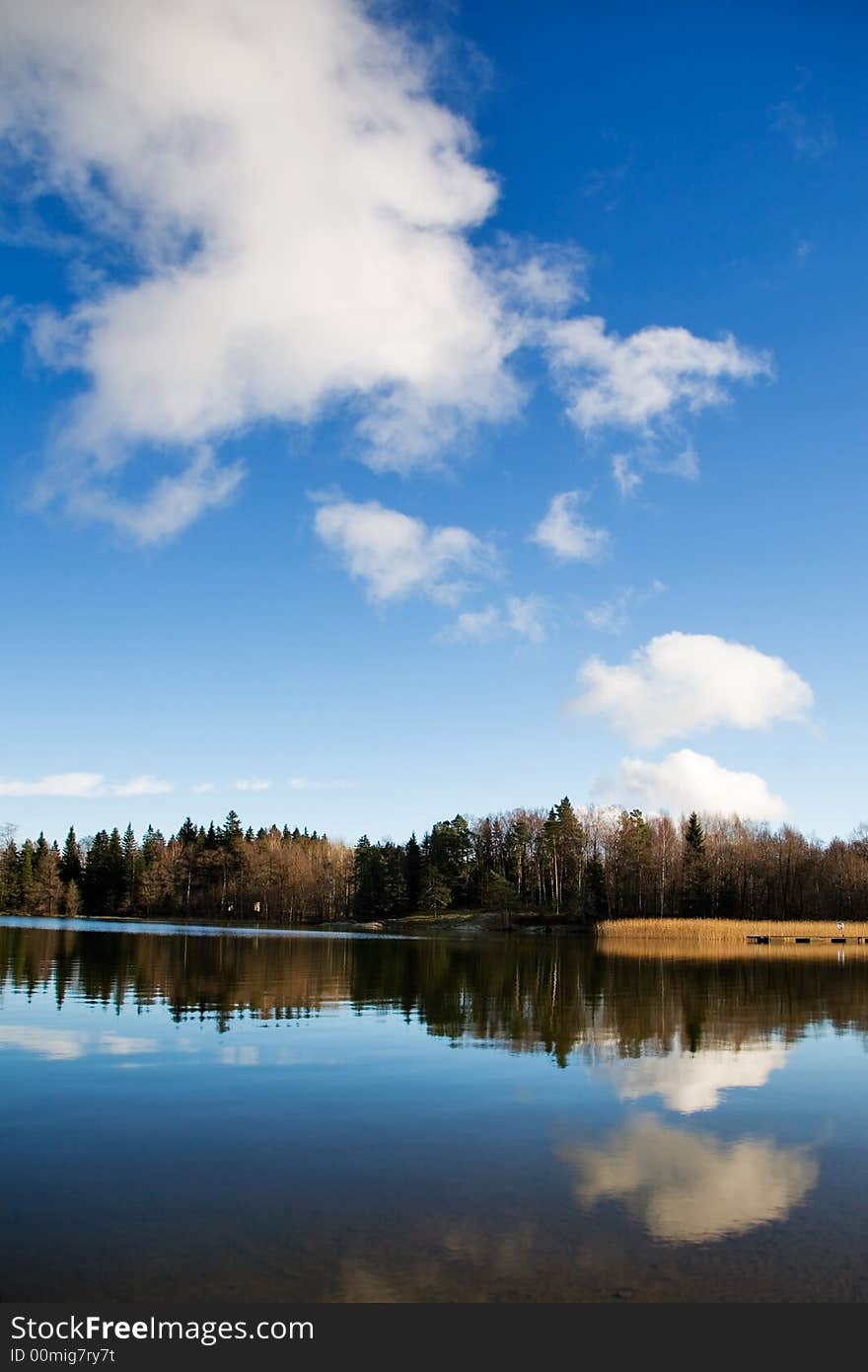 Autumn landscape with water reflection