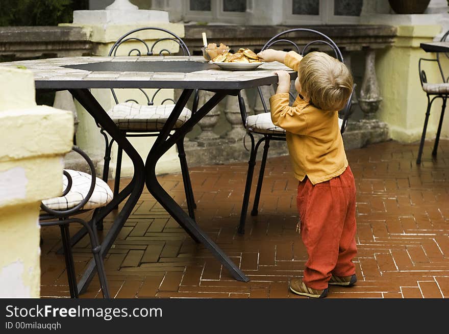 Beautiful little girl is eating pancakes. Beautiful little girl is eating pancakes