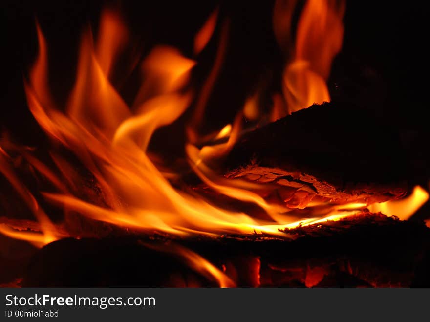 Flames in the fireplace in closeup. Flames in the fireplace in closeup