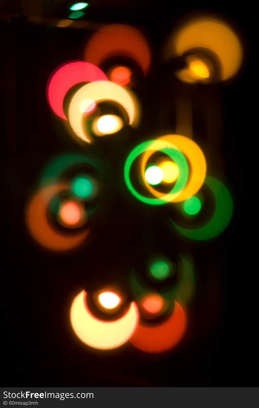 Blurry colored lights on a black background