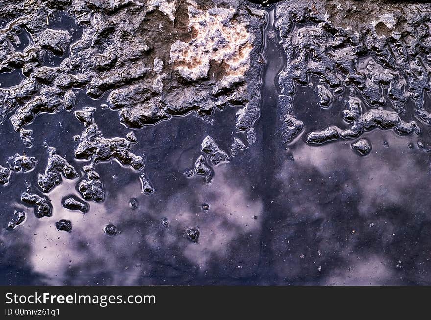 Sky reflecting in pool with asphalt. Sky reflecting in pool with asphalt