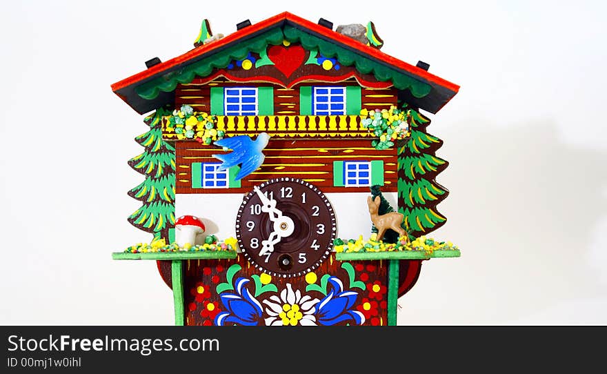 Toy house with bright colors and a clock