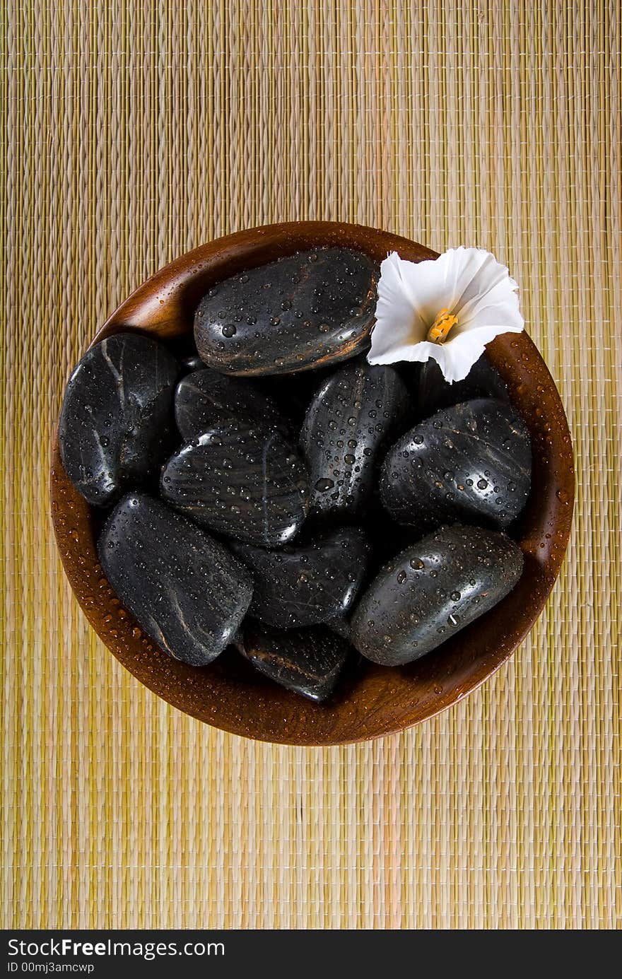 Spa products with stones in a bowl