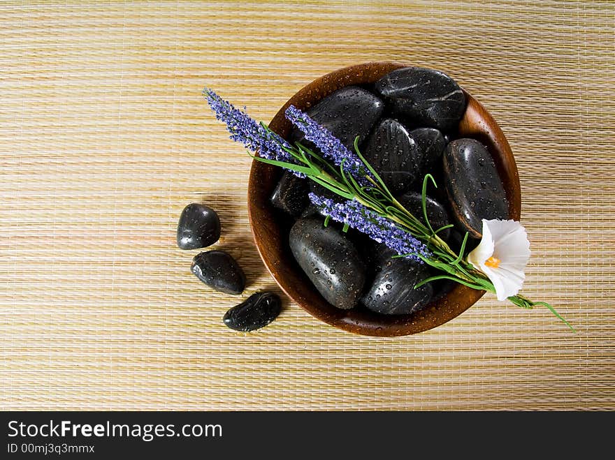 Bowl of hot stones for lastone massage. Bowl of hot stones for lastone massage