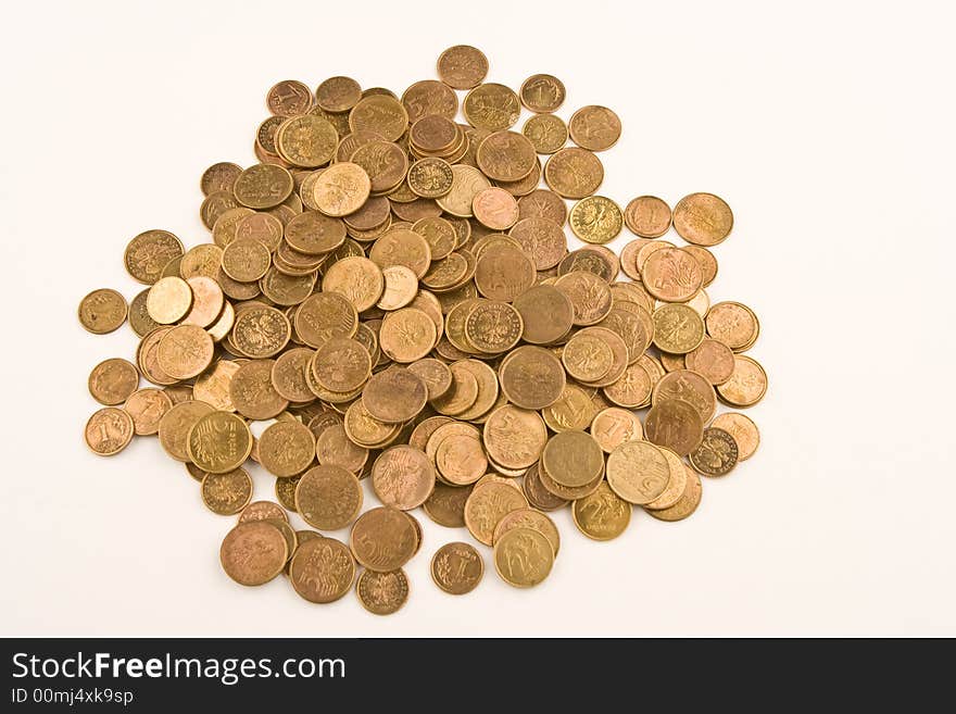 A pile of yellow coins against white background. A pile of yellow coins against white background.