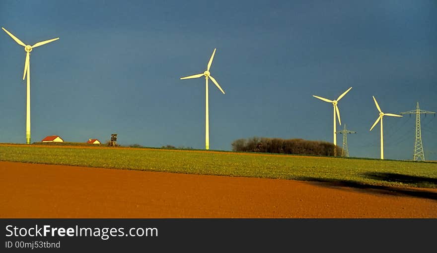 Windmills and field at the horizon. Windmills and field at the horizon