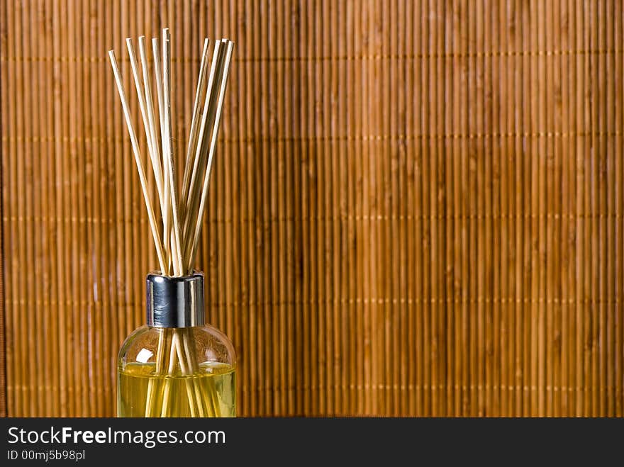 Aroma sticks dipped in scented oils on bamboo background. Aroma sticks dipped in scented oils on bamboo background