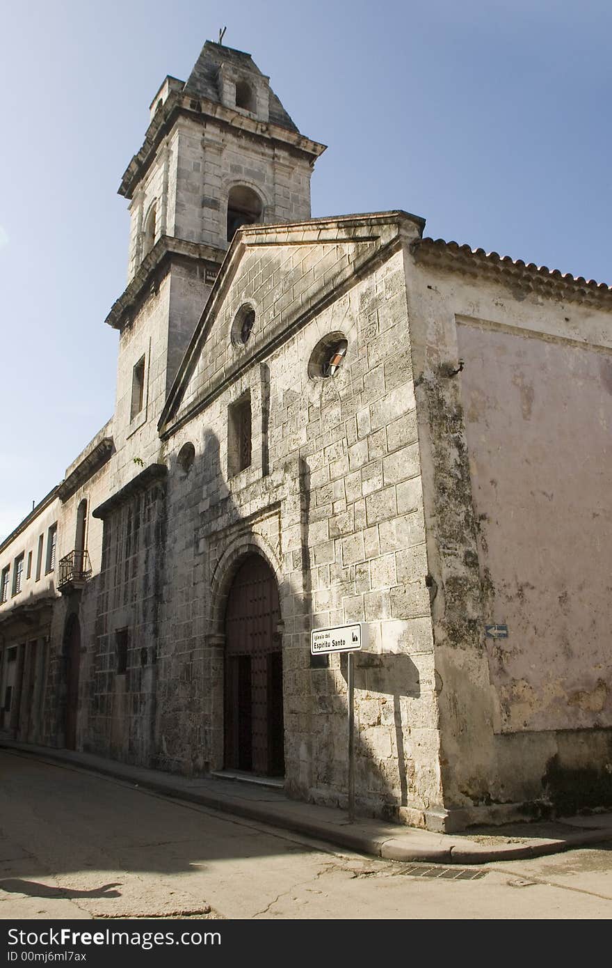 Old church of the Sacred Spirit in the historical part of the city of Havana, built in the time in that Cuba was Spanish colony. In the picture they can be observed, the steeple, the main door and the stone walls.