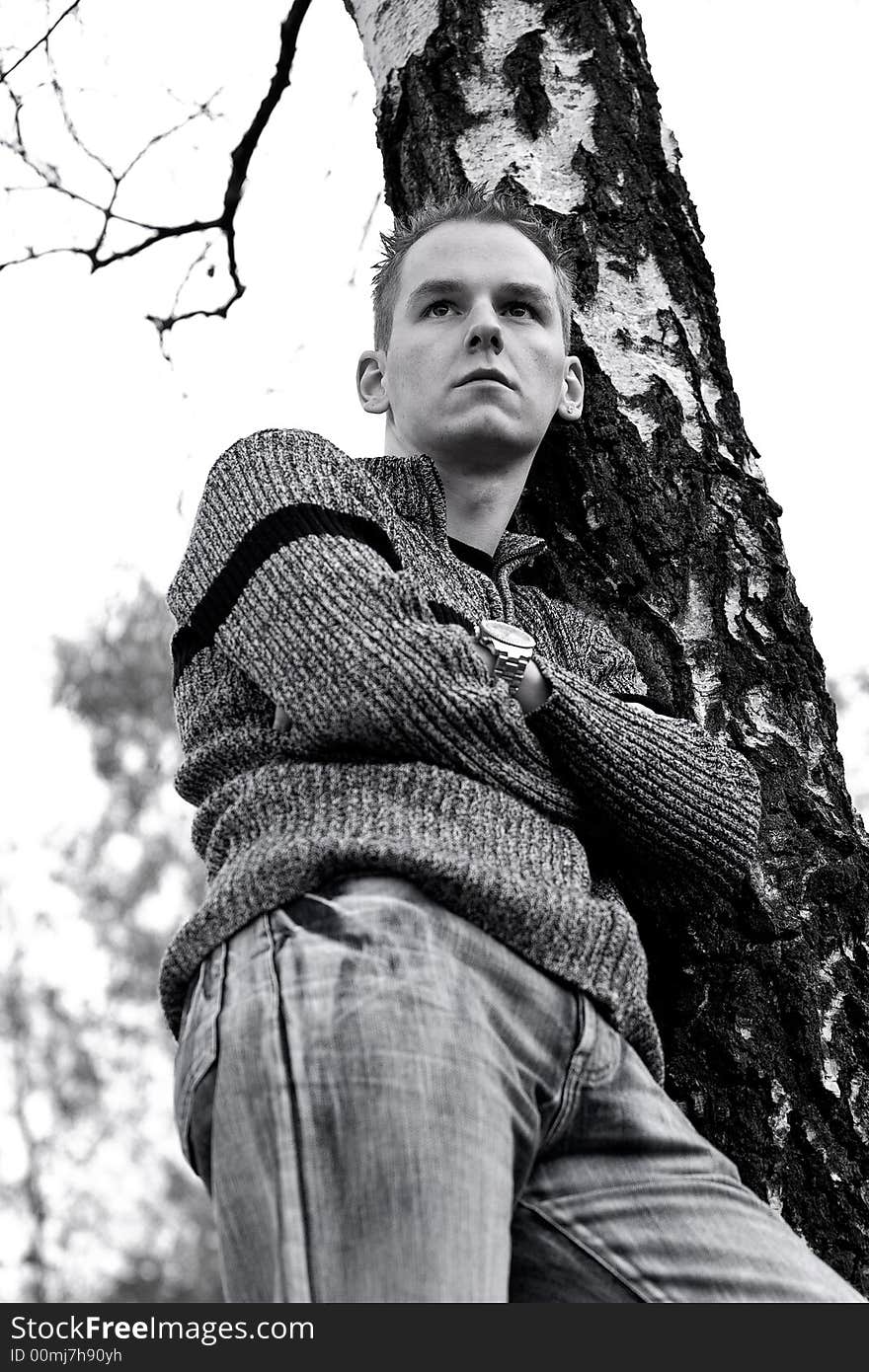 Boy in front of a dead tree. Boy in front of a dead tree