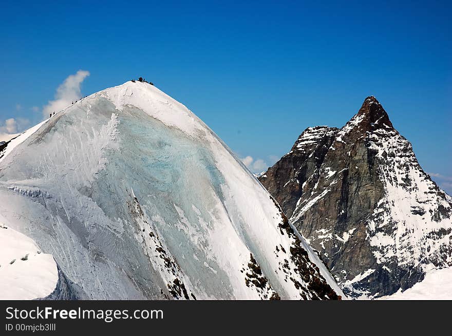 Breithorn peak, on background the Matterhorn, west alps, Europe.