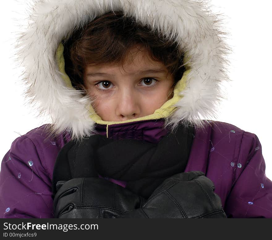 Preteen girl shivering in her outdoor winterwear. Preteen girl shivering in her outdoor winterwear.