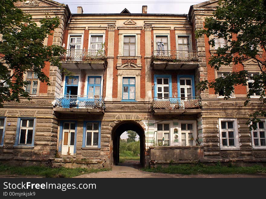 Old rusty building on the street of Gusev, Kaliningrad region, Russia. Old rusty building on the street of Gusev, Kaliningrad region, Russia