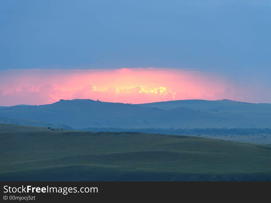 Sunset over mountain. Nature background.