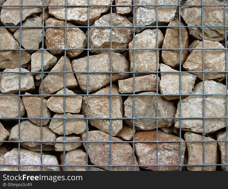 Limestone gabian wall, showing steel mesh grid