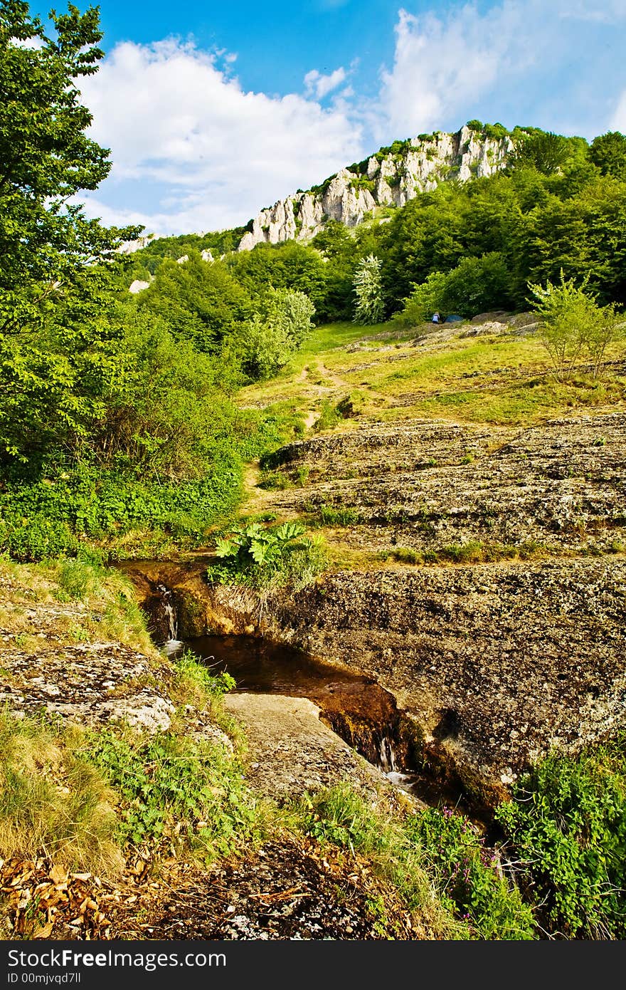 The mountain road which was surrounded in the fresh green. The mountain road which was surrounded in the fresh green