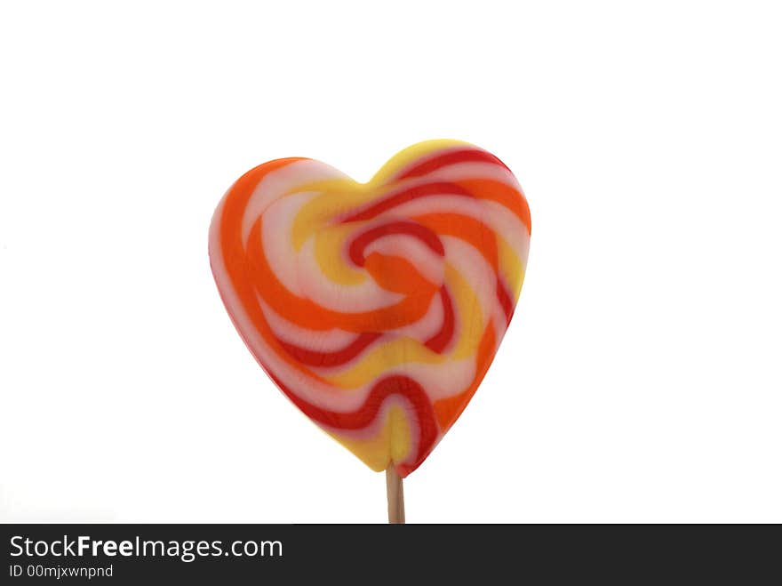 Heart shaped lollypop isolated on white. Heart shaped lollypop isolated on white.