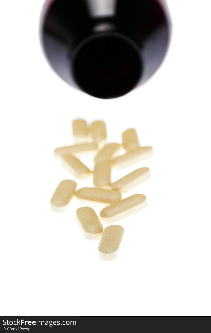 Pills In Front Of Dark Bottle, Medical Background,  Focus On Front. Pills In Front Of Dark Bottle, Medical Background,  Focus On Front