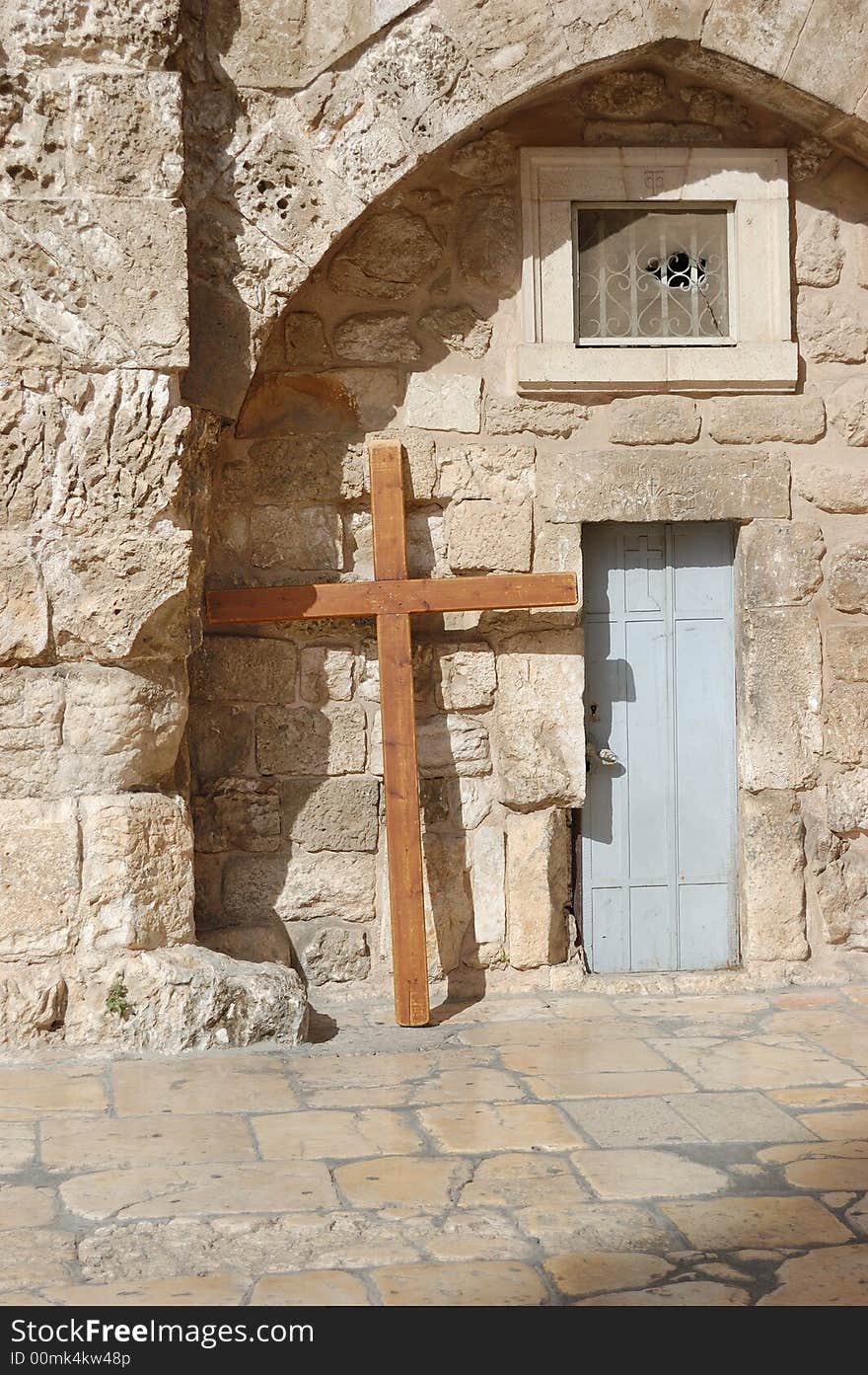 Cross at a wall of a temple