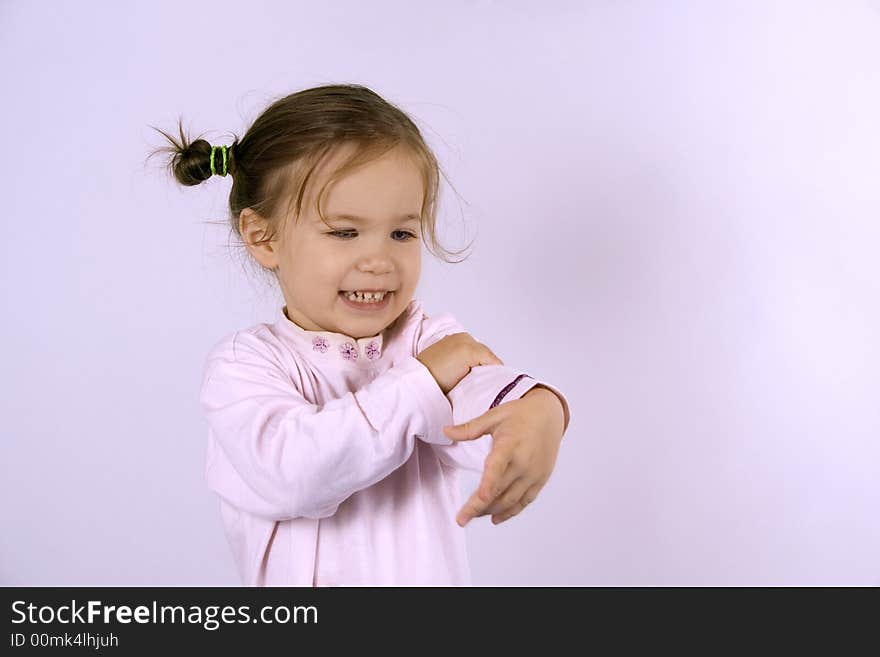 Little girl dancing on the white background