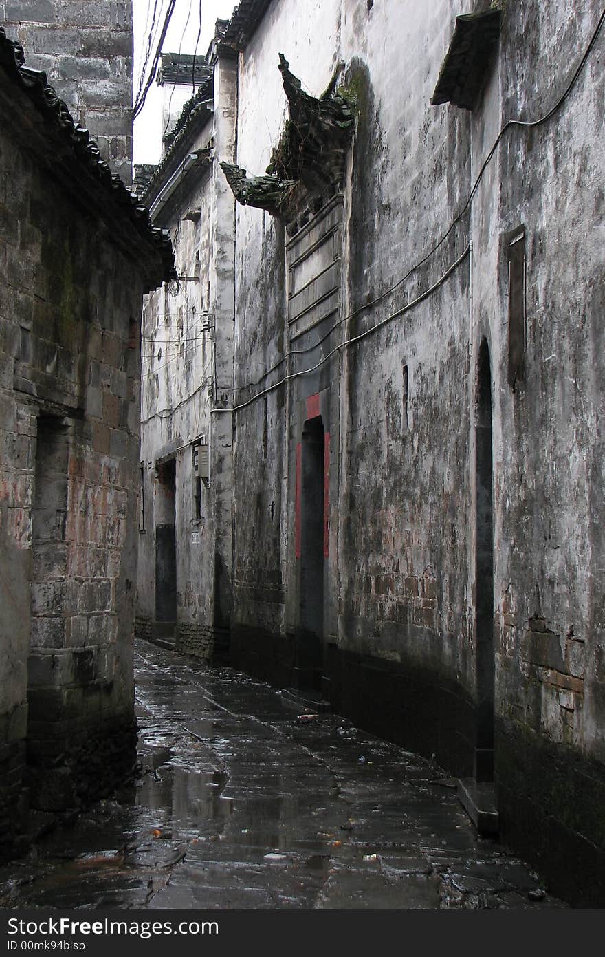 A quiet lane with historic houses at both side after rain, taken at Jiangxi China. A quiet lane with historic houses at both side after rain, taken at Jiangxi China