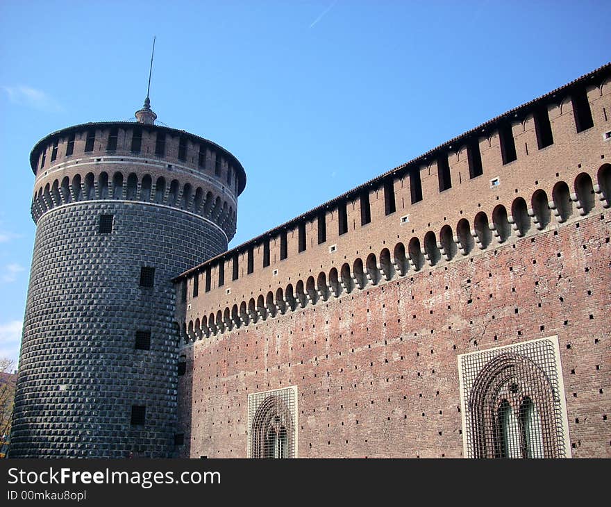 A part of the castle sforzesco in Milan under a blue sky