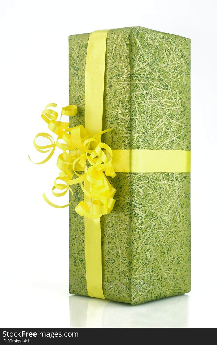 Green gift box with yellow ribbon isolated on white